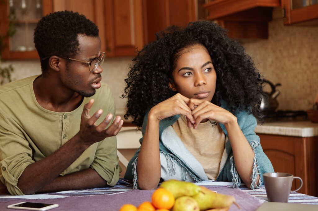 Why did you do this to me? Indignant depressed young Afro-American male in glasses trying to have co