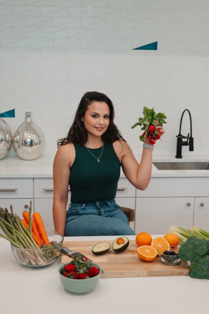 Stephanie Redmond smiling in a wellness setting
